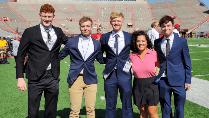 krnu2 students on memorial stadium football field