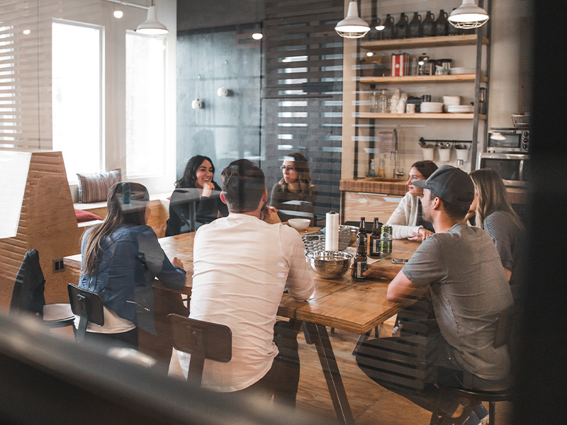 Young professionals, gathered around a table